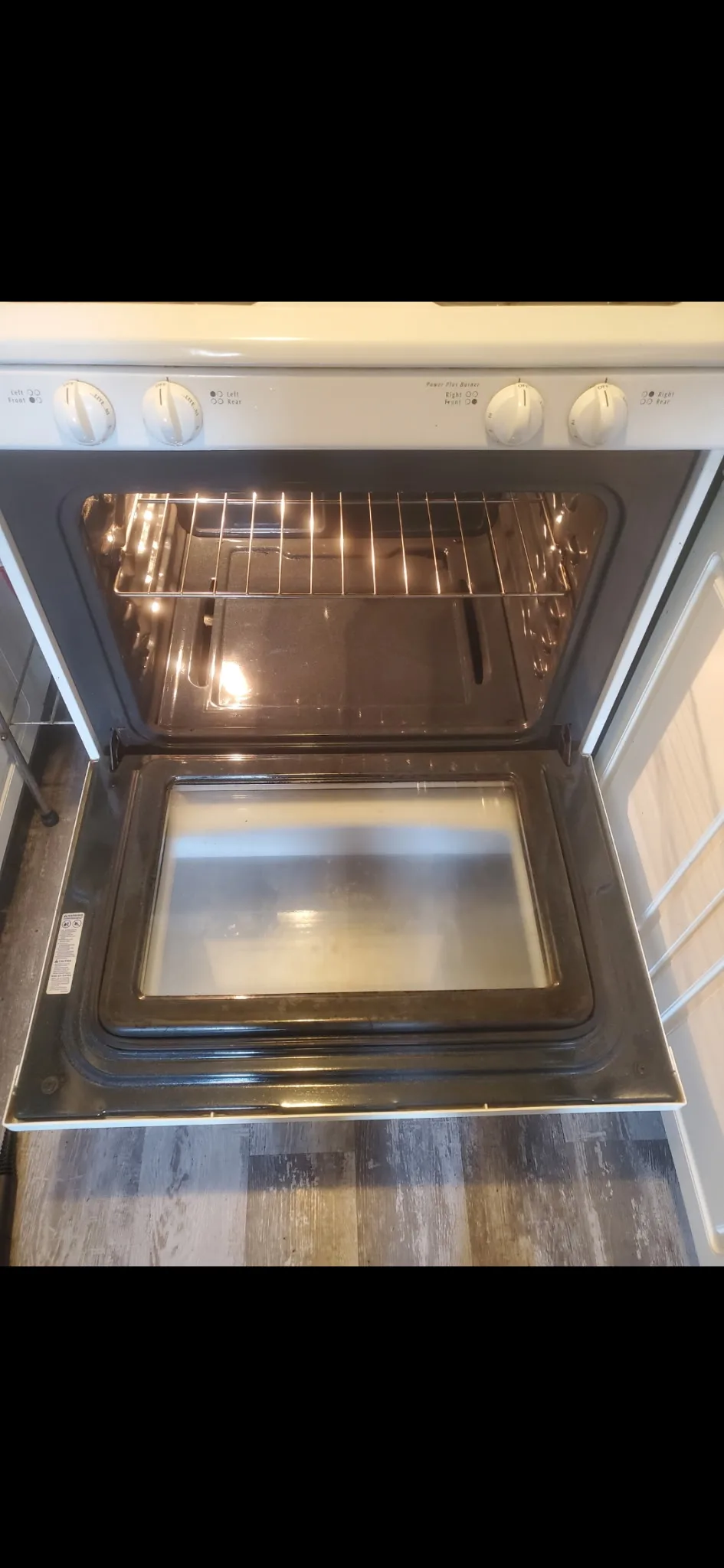 Clean oven with clear glass door after deep cleaning