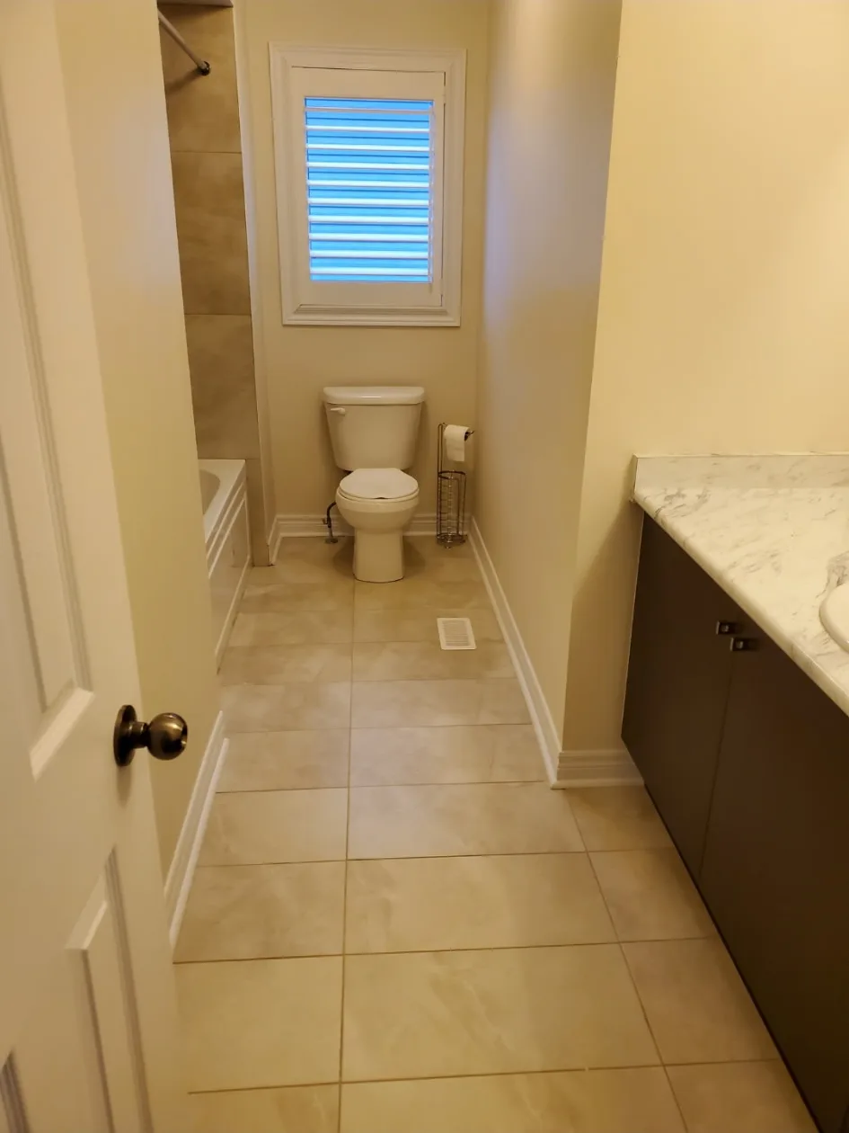 Cleaned bathroom with toilet vanity and bathtub