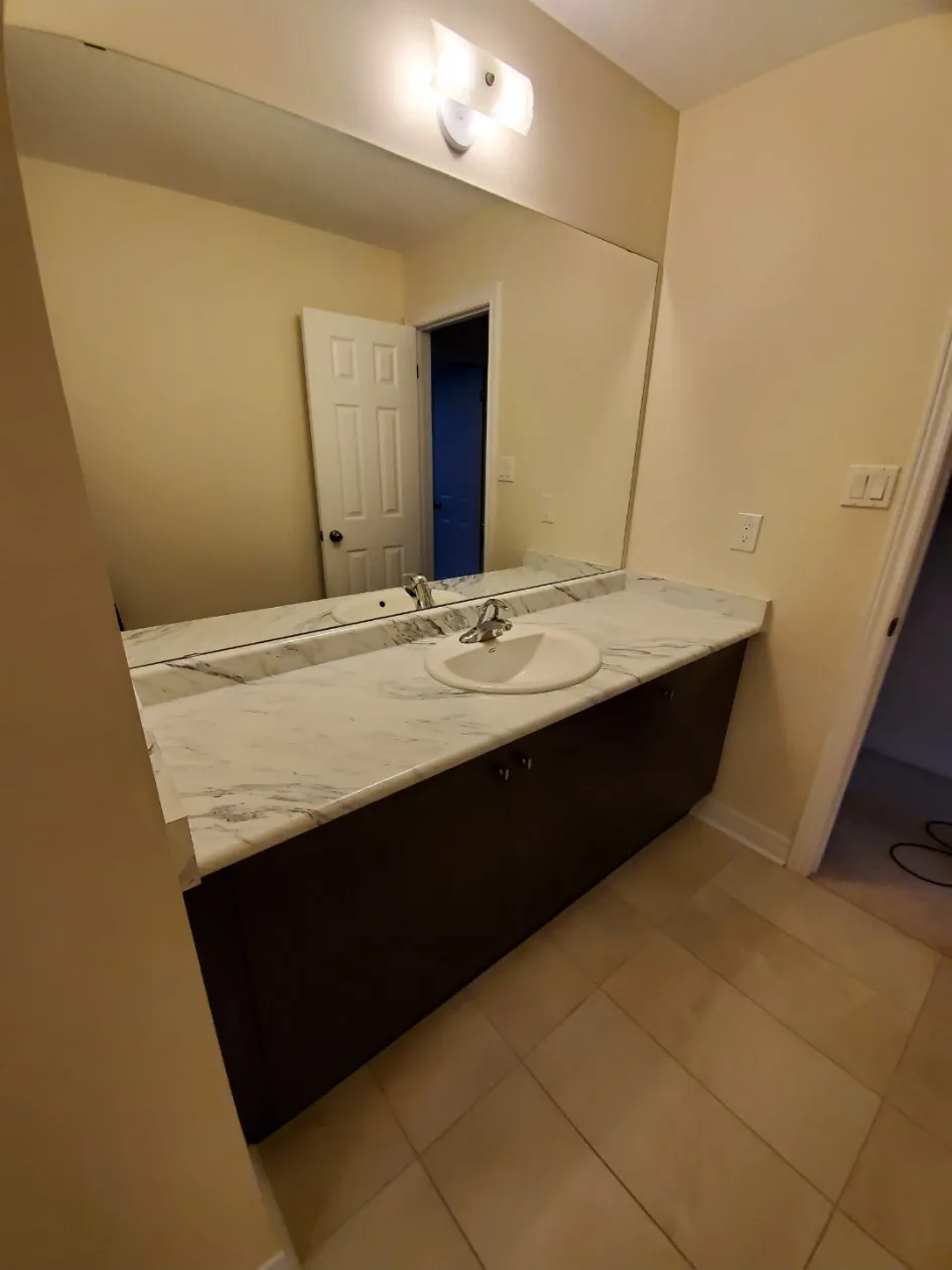 Clean bathroom vanity with marble countertop
