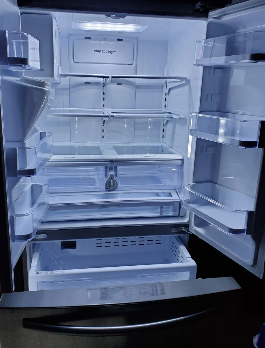 Sparkling clean refrigerator interior after deep cleaning