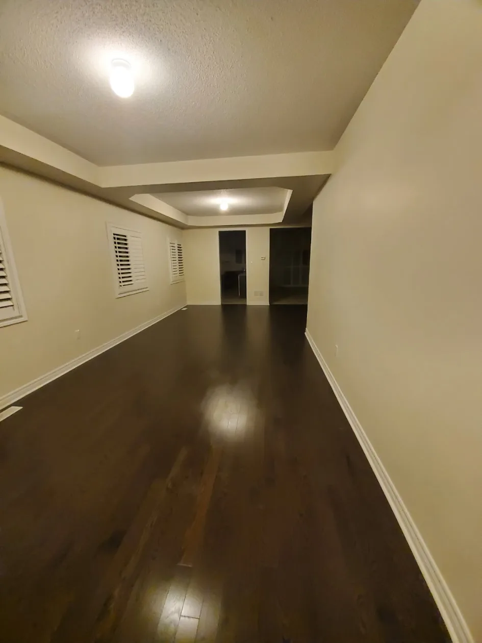Clean hallway with polished dark hardwood floors
